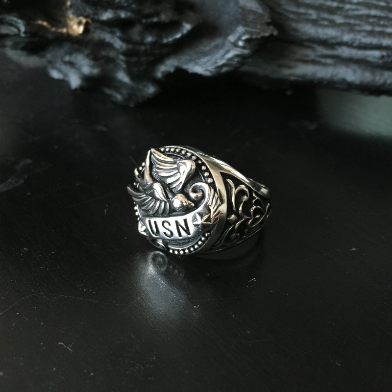 A solid sterling silver US Navy ring