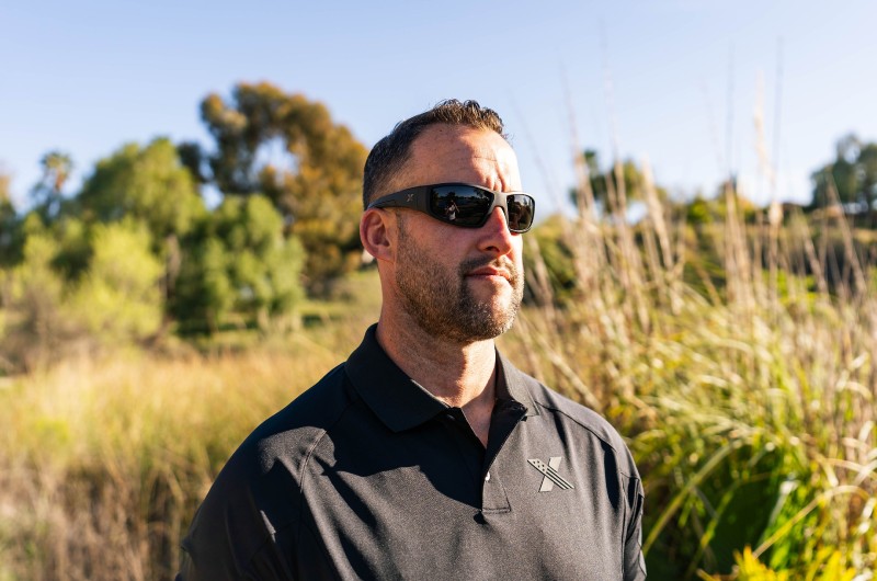 man wearing polarized sunglasses in a field