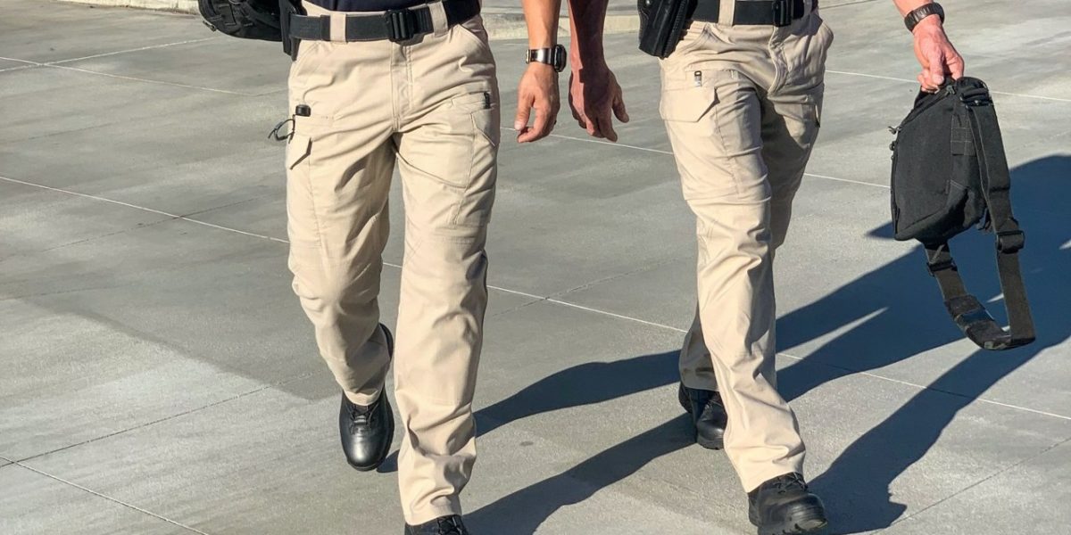 Police officers wearing tactical pants