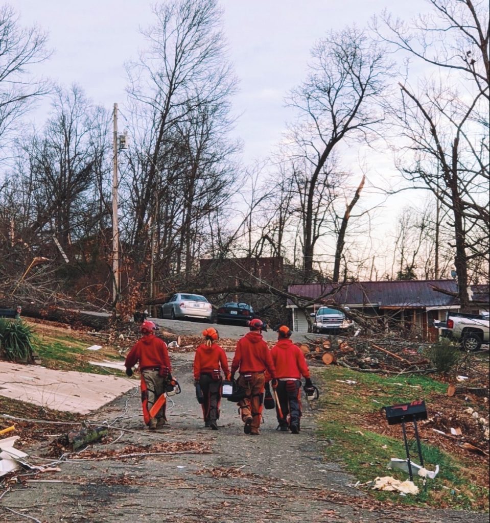 Team Rubicon volunteers in a storm-damaged neighborhood.